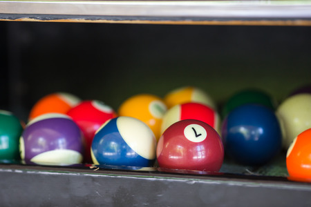 Billiard balls in a pool table