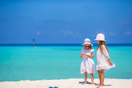 Adorable little girls having fun during beach vacationの写真素材