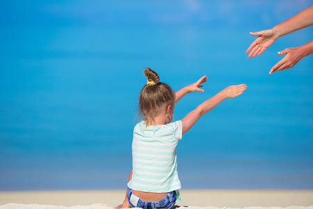 Adorable little girl at beach during summer vacationの写真素材