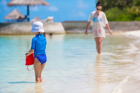 Little girl and happy mother during beach vacationの写真素材
