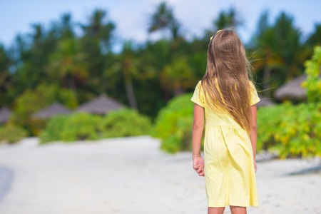 Adorable little girl at beach during summer vacationの写真素材
