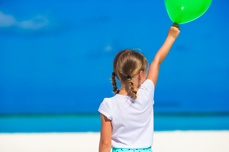 Adorable little girl with balloon outdoorの写真素材