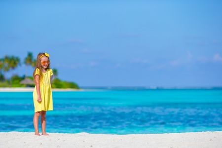 Adorable little girl at beach during summer vacationの写真素材