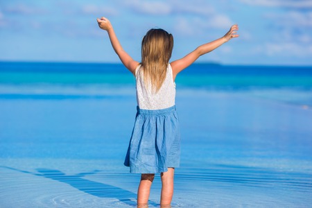 Adorable little girl at beach during summer vacationの写真素材