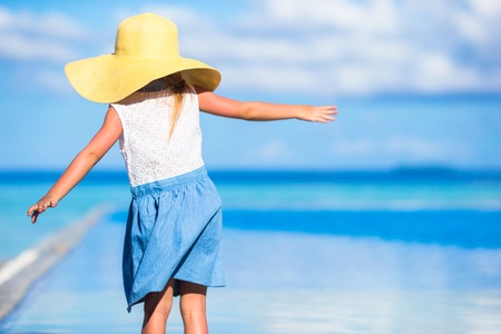 Adorable little girl at beach during summer vacationの写真素材