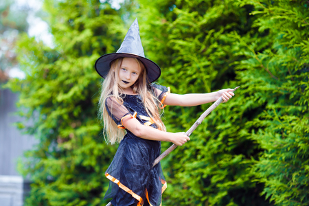 Happy girl in halloween costume with jack pumpkin.Trick or treatの写真素材