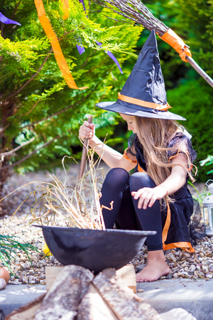 Happy girl in halloween costume with jack pumpkin.Trick or treatの写真素材