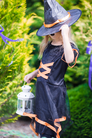 Happy girl in halloween costume with jack pumpkin.Trick or treatの写真素材