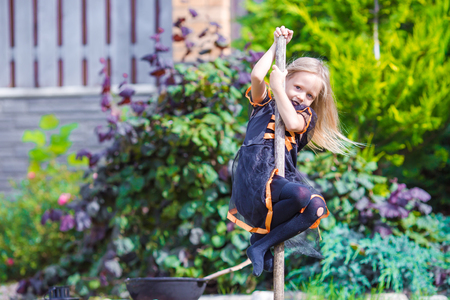 Happy girl in halloween costume with jack pumpkin.Trick or treatの写真素材