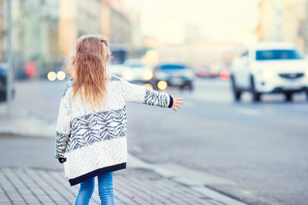 Adorable little girl outdoors in European cityの写真素材