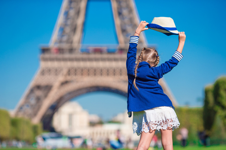 Adorable little girl in Paris background the Eiffel tower in Franceの写真素材