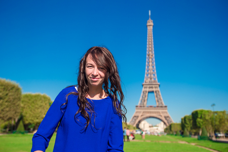 Adorable woman in Paris background the Eiffel tower in Franceの写真素材