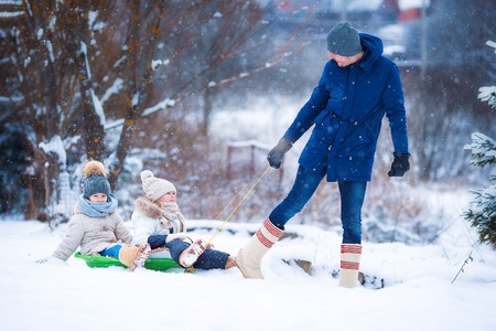 Family winter vacation on Christmas eve outdoorsの写真素材