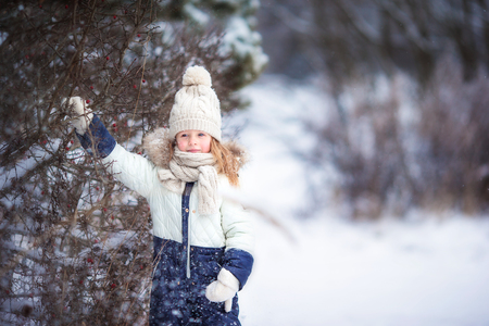 Cute little girl having fun in winter dayの写真素材