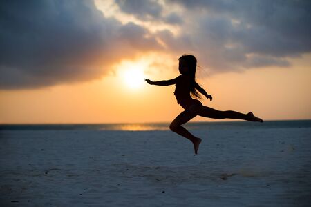 Adorable little girl at beach during summer vacationの写真素材