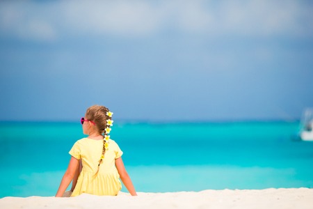 Cute little girl at beach during summer vacationの写真素材