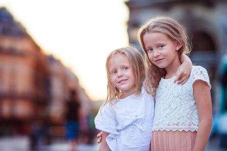 Adorable little girls outdoors in European city