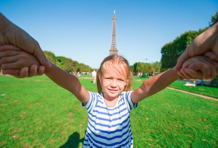 Adorable little girl in Paris background the Eiffel tower in Franceの写真素材