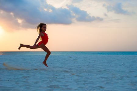 Adorable little girl at beach during summer vacationの写真素材