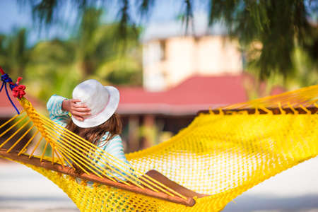 Woman relaxing on hammock on tropical vacationの写真素材