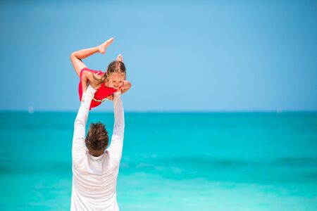 Happy father and his adorable little daughter enjoy summer vacationの写真素材
