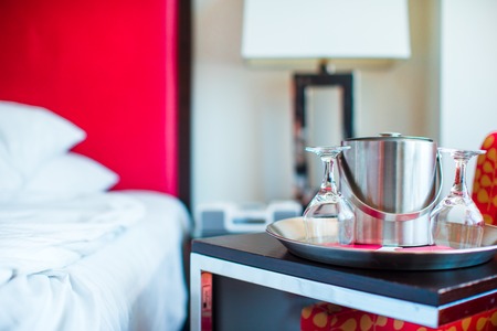 Two glasses on the double bed as romantic conceptの写真素材