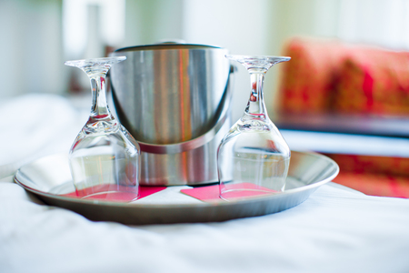 Two glasses on the double bed as romantic conceptの写真素材
