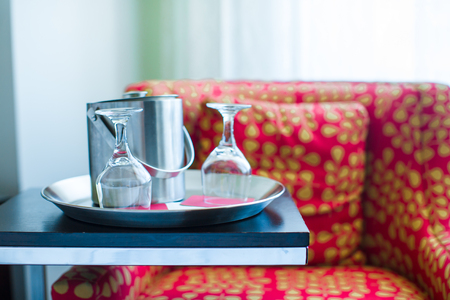 Two glasses on the double bed as romantic conceptの写真素材