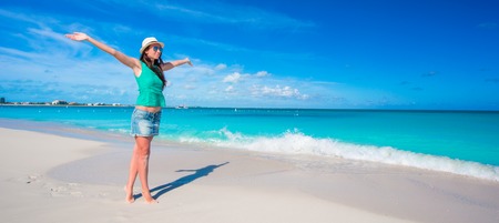 Young beautiful woman at shallow tropical waterの写真素材