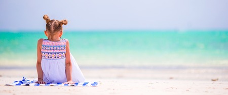 Cute little girl at beach during summer vacationの写真素材