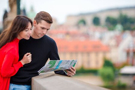 Happy tourist couple, man and woman traveling on holidays in Europe smiling happy. Caucasian couple.