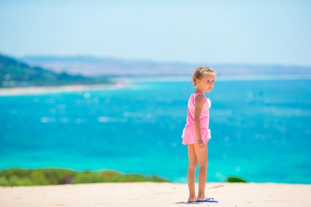 Cute little girl at beach during summer vacationの写真素材