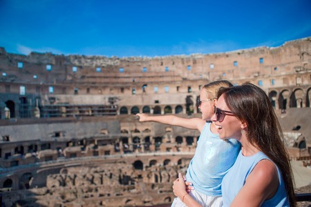 Happy family in Rome over Colosseum backgroundの写真素材