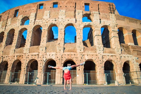 Little girl in front of colosseum in rome, italy