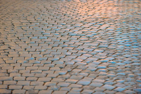 Ancient Roman street lit by a late afternoon sun.