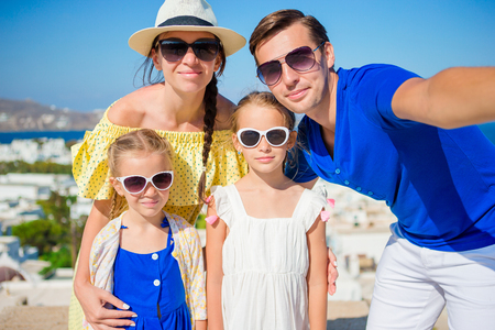 Family having fun outdoors on Mykonos islandの写真素材