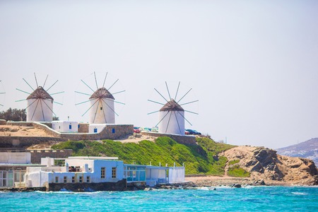 Old traditional windmills over the town of Mykonos.の写真素材