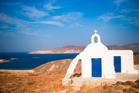 Traditional white house with sea view in Mykonos island,Greeceの写真素材