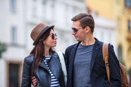 Happy tourist couple, man and woman traveling on holidays in Europe smiling happy.の写真素材