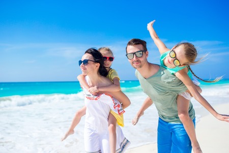 Young family on vacation have a lot of funの写真素材
