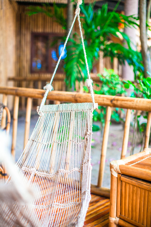 Hammock on terrace of cozy room in hotel in summer dayの写真素材