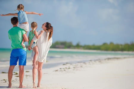 Young family on vacation have a lot of funの写真素材