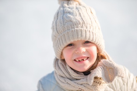 Adorable little girl going skate in winter snow day outdoorsの写真素材