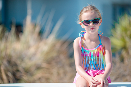 Portrait of adorable little girl in yoga outdoor on vacationの写真素材