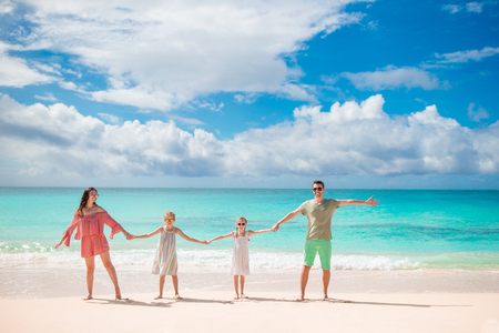 Young family on vacation on the beach. Family travel conceptの写真素材