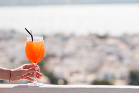 Closeup glass with alcohol drink background in beautiful old Mykonosの写真素材