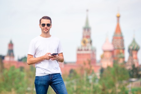 Happy young urban man in european city.の写真素材