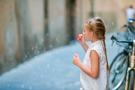 Adorable fashion little girl outdoors in European city Romeの写真素材