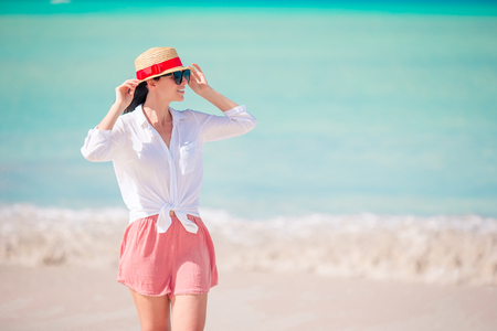 Young fashion woman in hat on the beachの写真素材