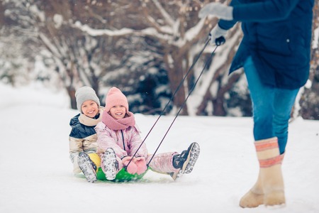 Family of dad and kids vacation on Christmas eve outdoors